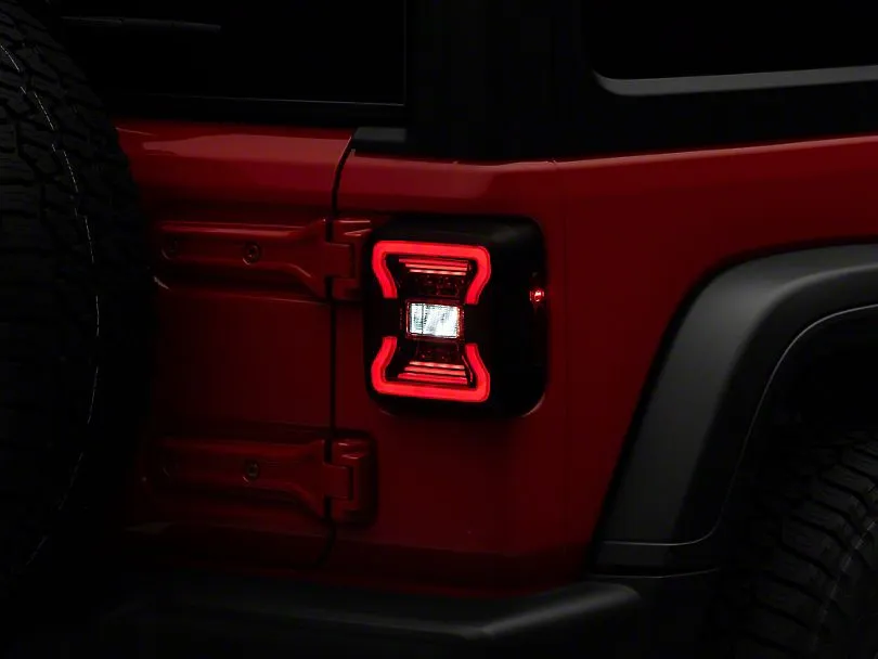 Raxiom Tail Lights Jeep Wrangler JL (18-23) [w/ Factory Halogen Lights] Black Housing / Smoked or Red Lens